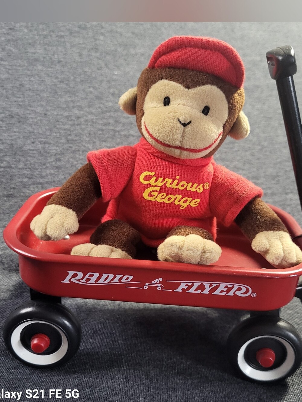 Vintage Curious George Plush Monkey in Red Tee and Hat– In a Radio Flyer Wagon.